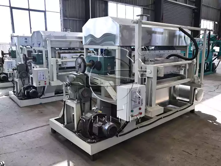 Paper pulp molding machines